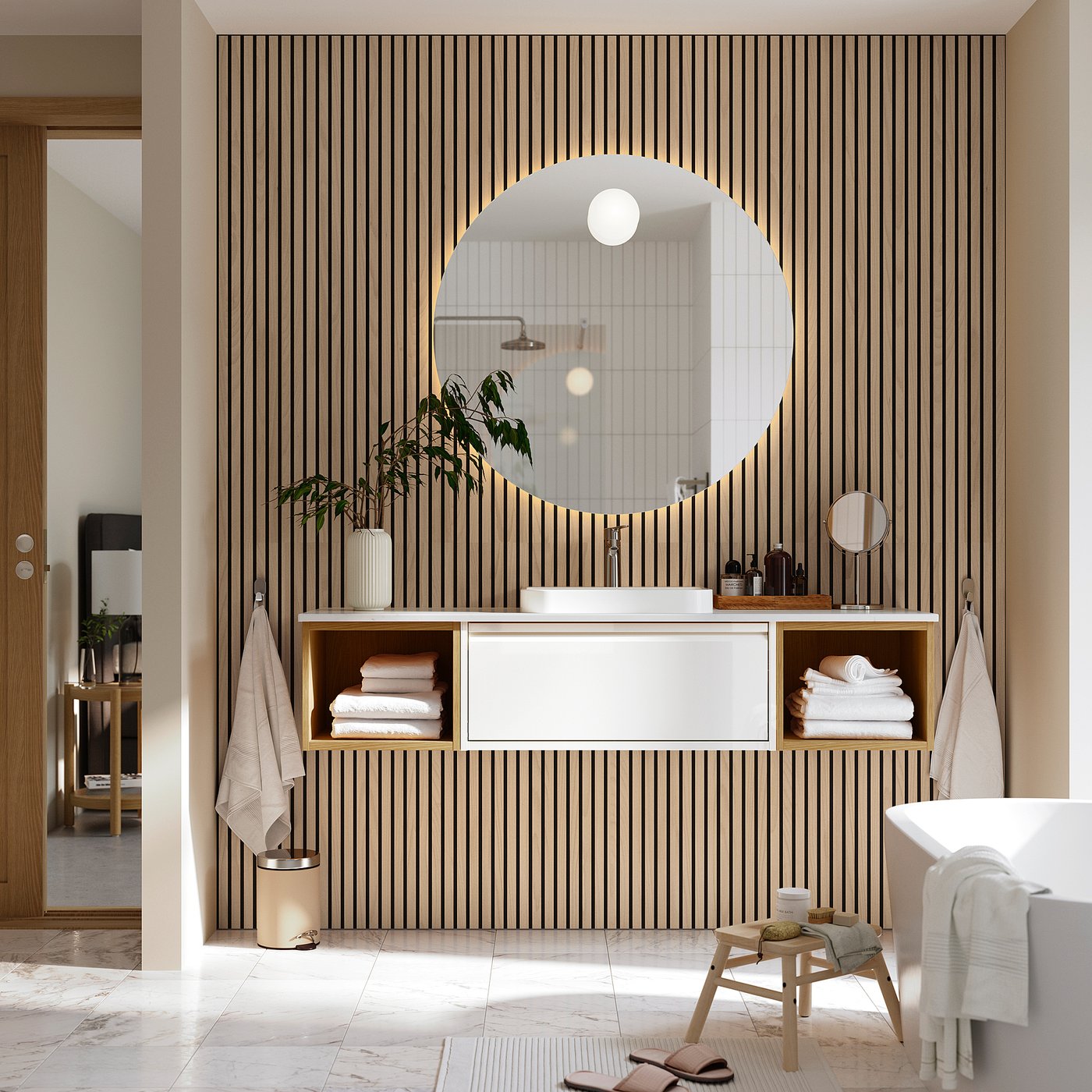 Modern bathroom with white floating cabinet, marble sink, and arched mirror against a striped wall. A wooden stool and towels are placed nearby.