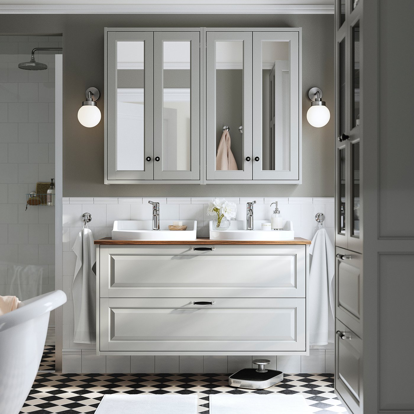 Modern bathroom with gray TÄNNFORSEN vanity and sink, chrome fixtures, and checkered floor.
