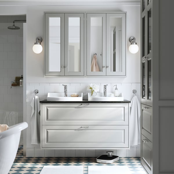 Modern bathroom: white, grey vanity, tub, tiled walls, checkered floor.