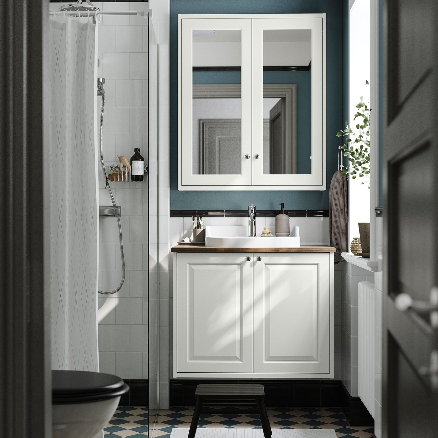 Modern bathroom: TÄNNFORSEN sink, blue walls, checkered floor, black toilet, partial shower, large mirror.