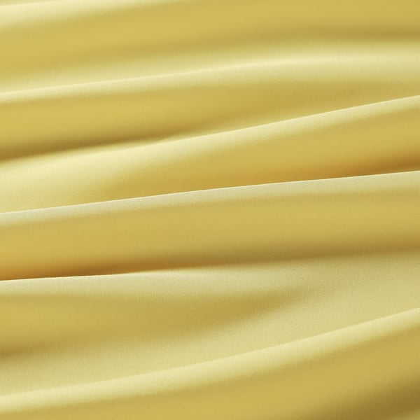 Golden fabric close-up, soft recycled polyester.