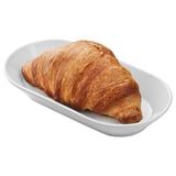 Vegan croissant-like pastry with crispy layers, served on a plate.