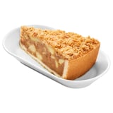 Image shows a dessert in a white dish. Buttery layers with cinnamon and crumble topping, filled with soft apple pieces.