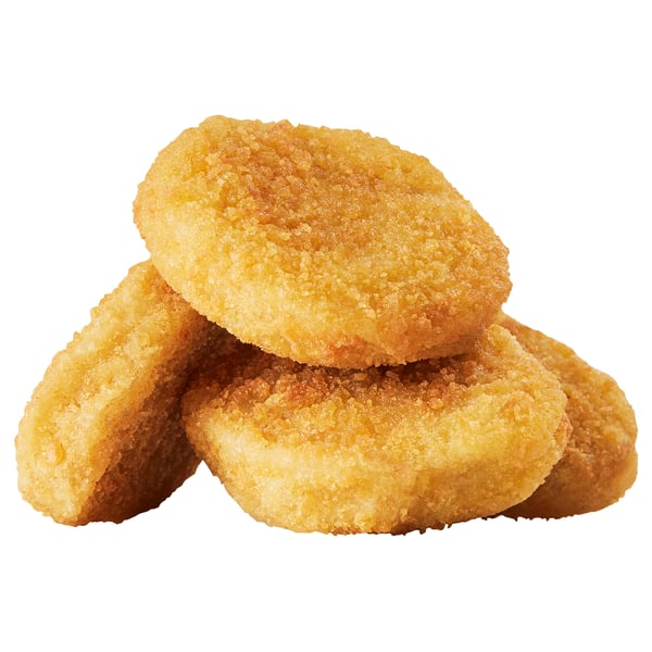 Tament d’aliments frits brun doré, croustillants et empilés.