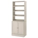 A light beige HAVSTA storage unit. It open shelves on top and closed cabinets below with a wooden design.