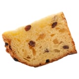 Large slice of raisin bread, soft and light with visible chunks of raisins throughout.