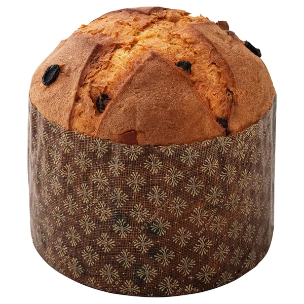A round, golden-brown baked good with dark spots, wrapped in patterned paper. It appears to be a type of pastry or bread.