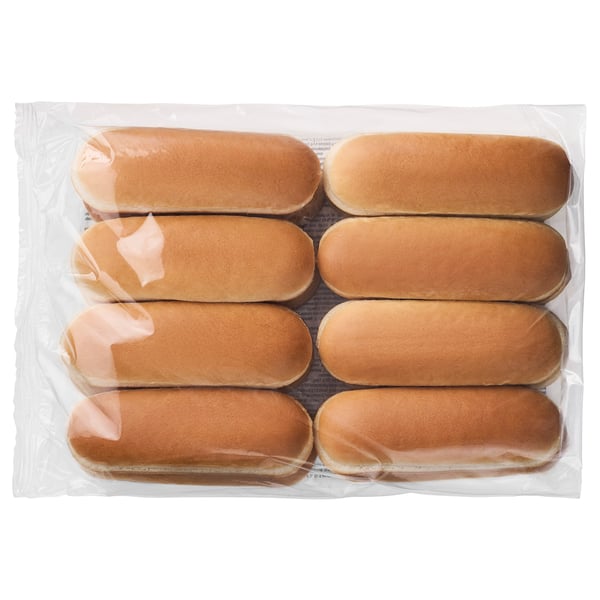 Helder brood in zakjes: acht ovale broodjes, vers en uniform, klaar om te serveren.