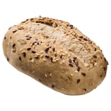 Round bread loaf topped with assorted seeds.