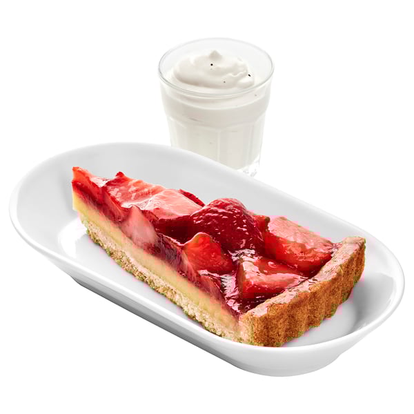 Image a strawberry tart with whipped cream on a white plate. Tart has a golden crust with fresh strawberries on top.