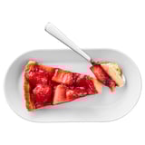 Image description: slice of strawberry cream cake on a white plate with a fork.