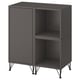 Black EKET storage unit with closed and open sections. Square design, metal legs, sleek finish.