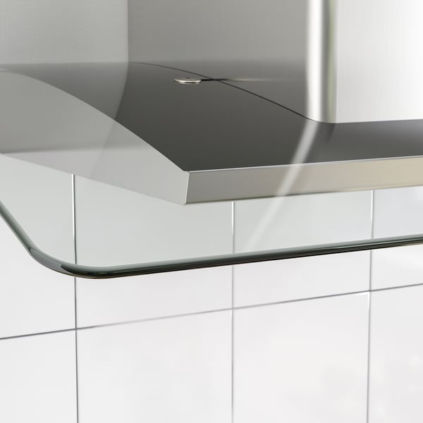 Stainless steel and glass range hood with sleek lines and led lighting.