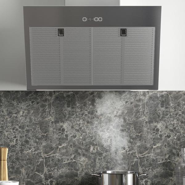 Stainless steel range hood with led lighting, extracting smoke.