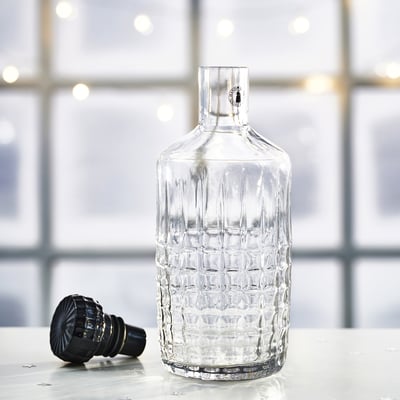 Frójda glass carafe with black stopper, clear, faceted, cylindrical shape.