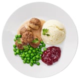 Mit Fleischbällchen, Erbsen, Kartoffelpüree und Marmelade anrichten.