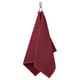 A hanging maroon GULVIAL towel, soft and thick, crafted from 100% cotton, rectangular shape, draped neatly on a hook.
