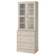 A light-colored wooden HAVSTA furniture unit with glass doors and drawers.
