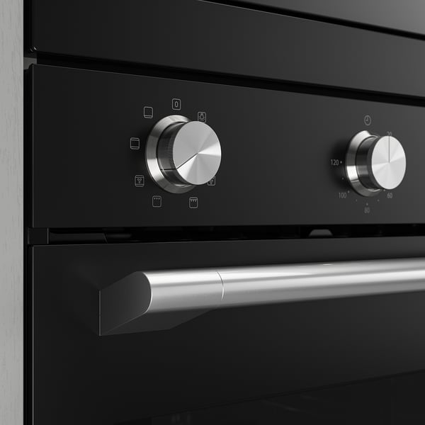Modern oven control panel with sleek metal knobs and digital display, showcasing high-quality design and functionality.