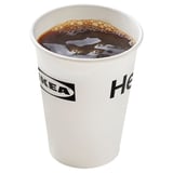 Disposable paper cup with dark liquid, IKEA logo, white.