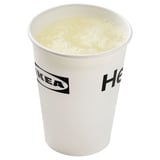 Drink in IKEA cup with foam top. Light yellow beverage.
