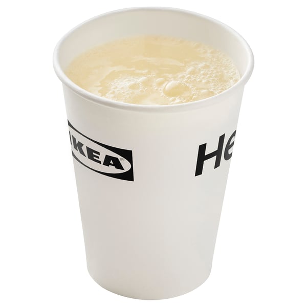 A white IKEA cup filled with a creamy liquid, likely a drink.