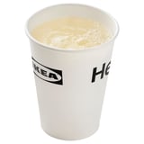 A white IKEA cup filled with a creamy liquid, likely a drink.