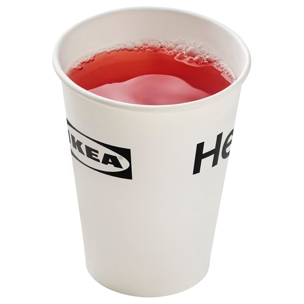 Image shows a white IKEA cup filled with red liquid, likely a food item.