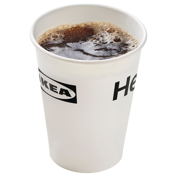 IKEA branded cup filled with dark carbonated drink.