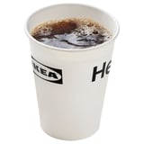 IKEA branded cup filled with dark carbonated drink.