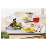 A meal on a white tray with plates of food and cutlery.
