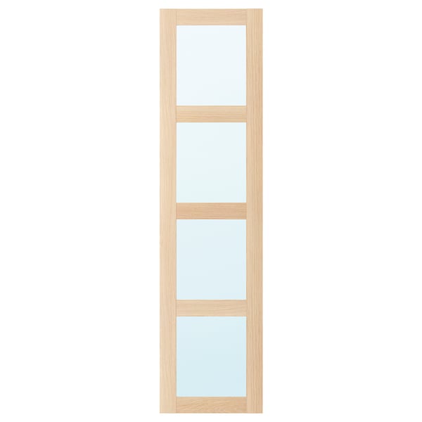 Wysokie, wąskie drzwi lustrzane BERGSBO, z jasną drewnianą ramą z przezroczystymi szklanymi panelami, oferujące prosty i funkcjonalny design.