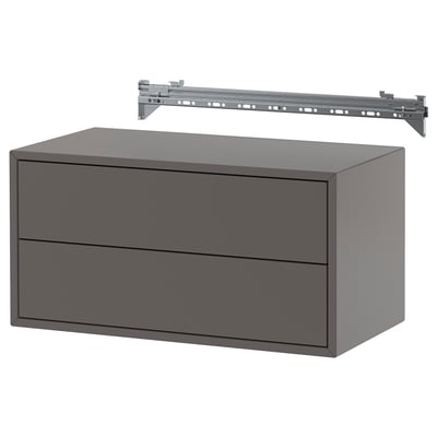 Szara szafka wisząca z dwiema szufladami i metalową prowadnicą do zawieszenia. Prosty, nowoczesny design z czystymi liniami. Idealny do przechowywania.
