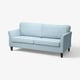 Niebieska sofa EKHOLMA o eleganckim designie, drewnianych nogach i miękkich poduszkach.