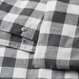 Poszwa na kołdrę w czarno-białą kratę z zapięciem na guziki, wykonana z bawełny organicznej.