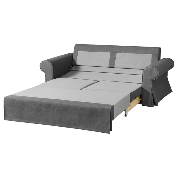 Szara rozkładana sofa Evertsaberg ze schowkiem na siedzisko, miękkie poduszki, rozkładany design.