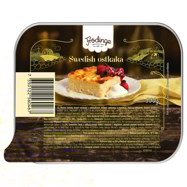 Opakowanie sernika szwedzkiego FRÖDINGE. Wyświetla plasterek sernika z jagodami na żółtej tkaninie.