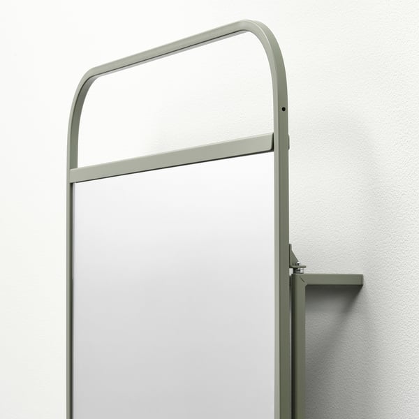 Nowoczesne lustro ze zintegrowanymi haczykami, elegancka zielona metalowa rama, solidna konstrukcja.
