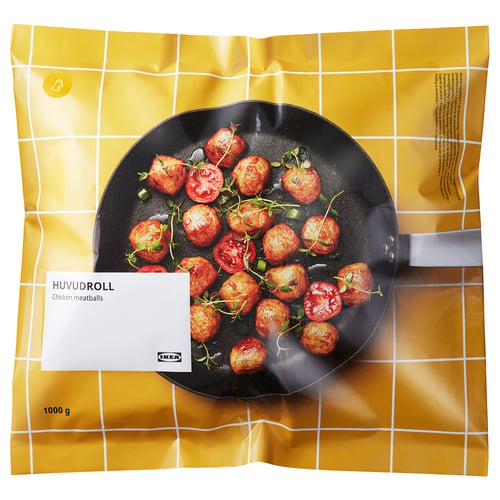 Opakowanie klopsików z kurczaka IKEA HUVUDROLL, przedstawiające klopsiki gotujące się na patelni.