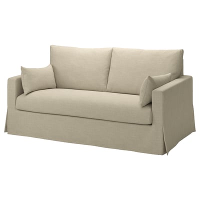 Miękka beżowa sofa, elegancki minimalistyczny design, z trzema poduszkami, teksturowana tkanina.