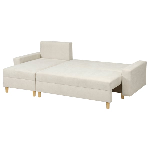 Kremowa sofa JÄRINGSHOLM z leżakiem o minimalistycznym designie i drewnianych nogach.