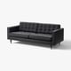 skórzana sofa, faftowane poduszki, drewniane nogi, elegancki design z połowy XX wieku.