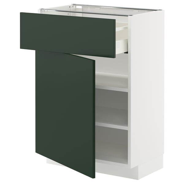 Nowoczesna biała szafka do przechowywania z zieloną szufladą i drzwiami, minimalistyczny design.