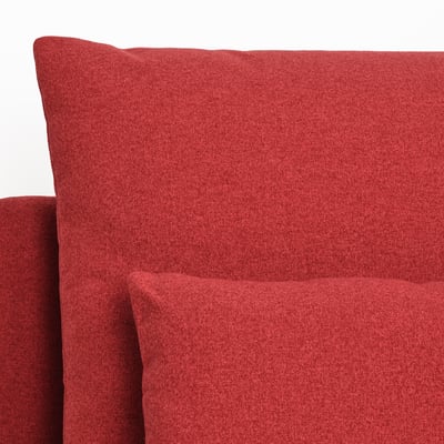 Jaskrawoczerwony, miękki, tapicerowany narożnik sofy, gładka tkanina, nowoczesny design.