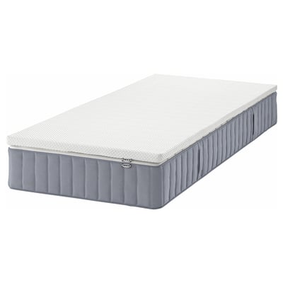 IKEA VALEVÅG szary materac typu pillow-top o białej fakturze.