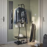Black ÄLGANÄS rack stores jackets, headphones, helmet, and sneakers, ideal for compact spaces.