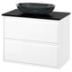 Modern white bathroom vanity with sleek black counter and dark glass basin.
