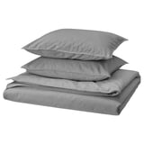 A set of grey, folded bed linens including a duvet cover and two pillowcases, made from 100% cotton.