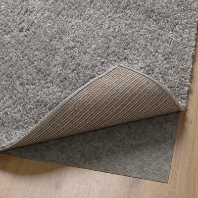 Grey plush rug with anti-slip backing and soft pile.