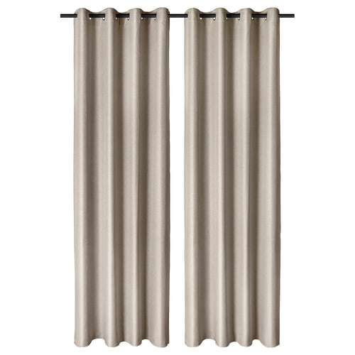 Two beige curtains hang side by side with modern eyelet design, providing privacy and slight room dimming.